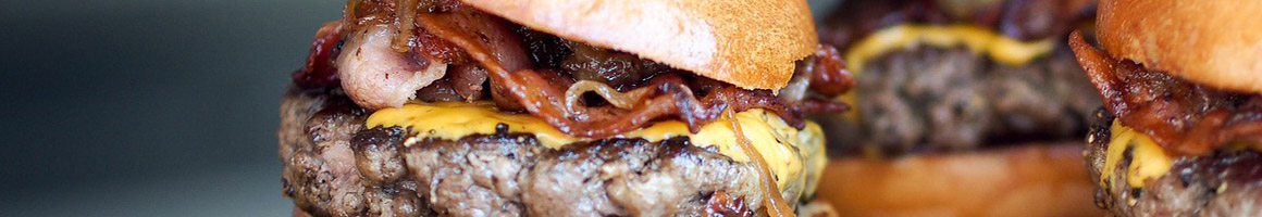 Eating American (Traditional) Burger at Saddlehorn Station restaurant in Bigfork, MT.